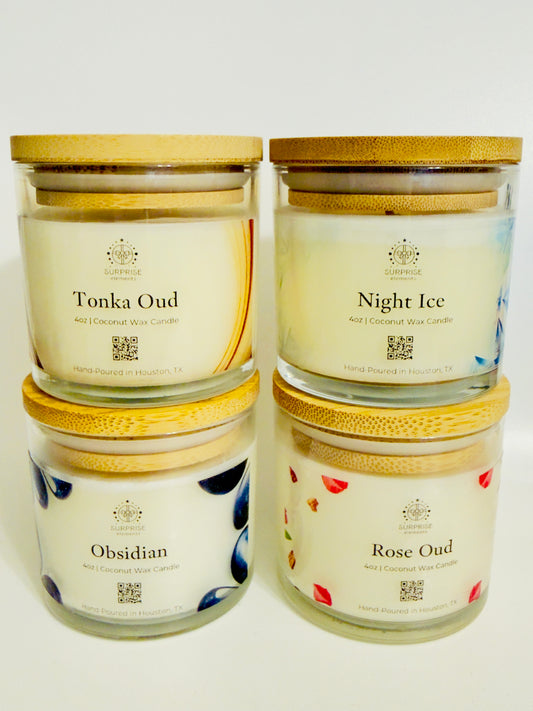 Four candles with different scents on a white background