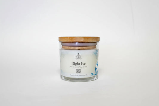 Candle in a glass jar with a bamboo lid on a white background 4oz clear jar coconut wax candle hand-poured Houston Texas