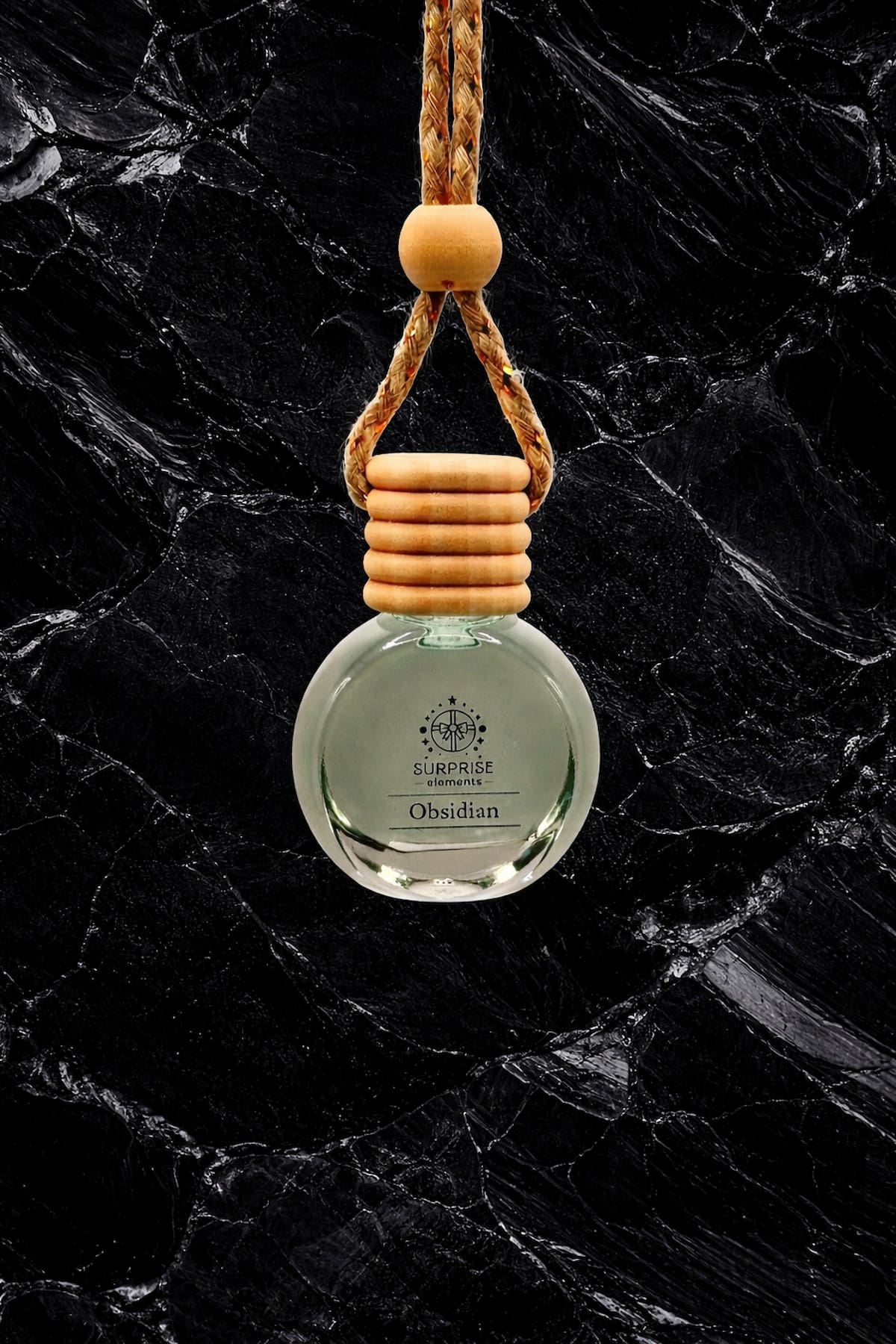 Car air freshener with wooden holder on a dark marble background