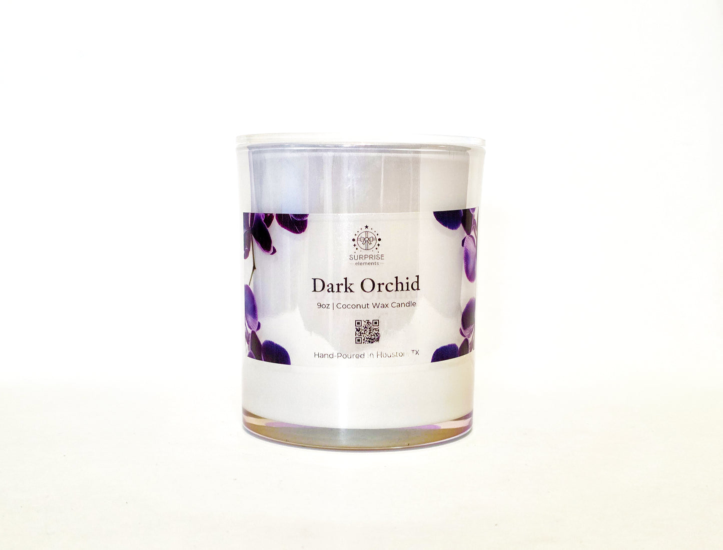 Candle in a glass jar labeled 'Dark Orchid' on a white background 9oz jar coconut wax candle hand-poured in Houston Texas 