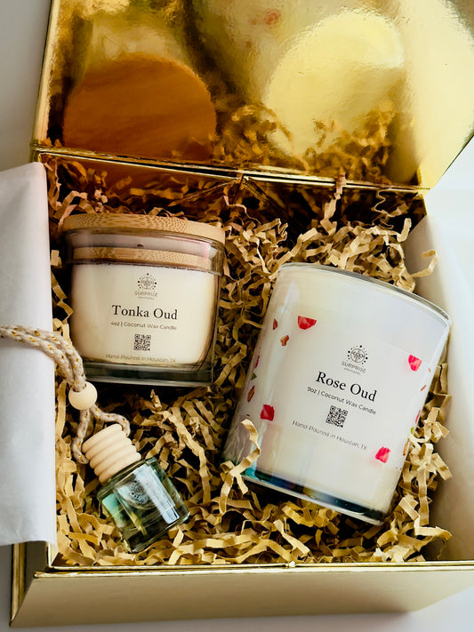 Gift set with candles and a bottle of car fragrance in a decorative box. 
Tonka oud 4oz coconut wax candle.
Rose oud 9oz coconut wax candle 
obsidian car fragrance  hand-poured in Houston Texas 