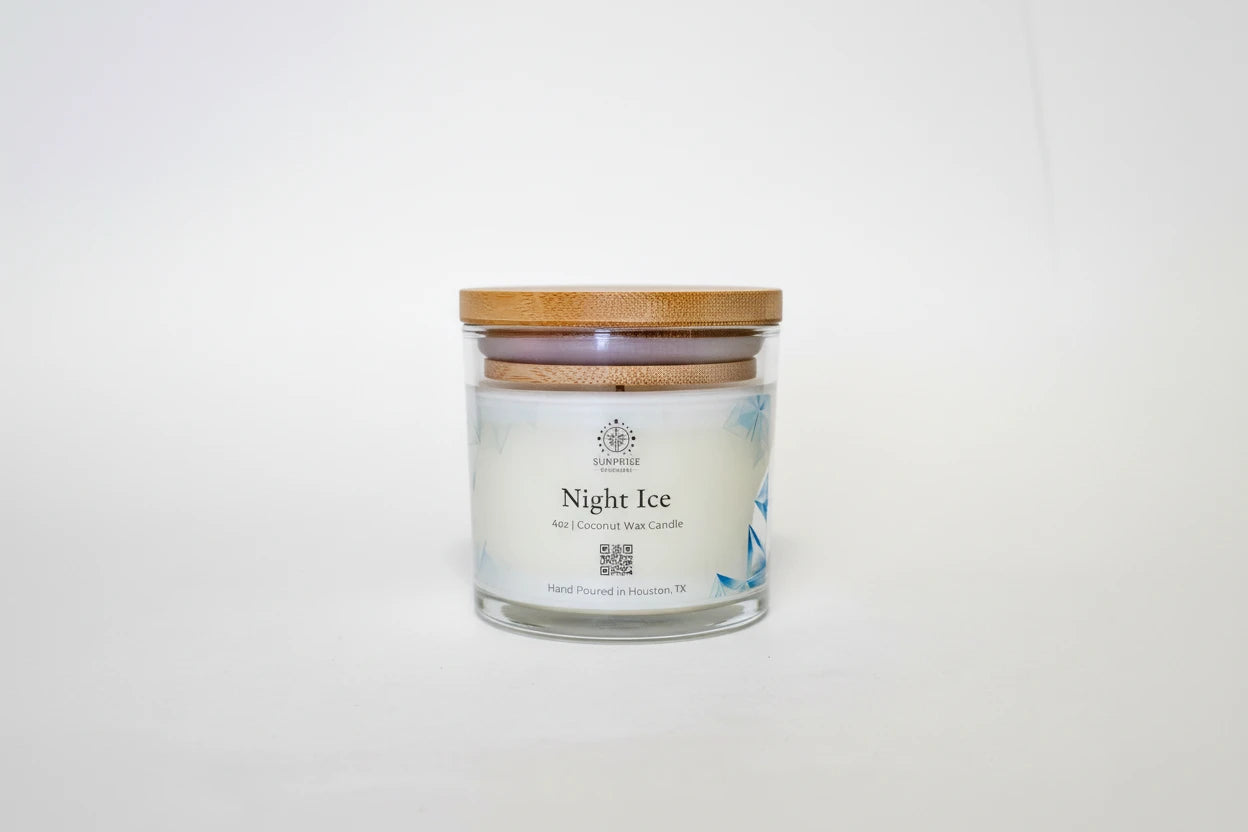 Candle in a glass jar with a bamboo lid on a white background 4oz clear jar coconut wax candle hand-poured Houston Texas 