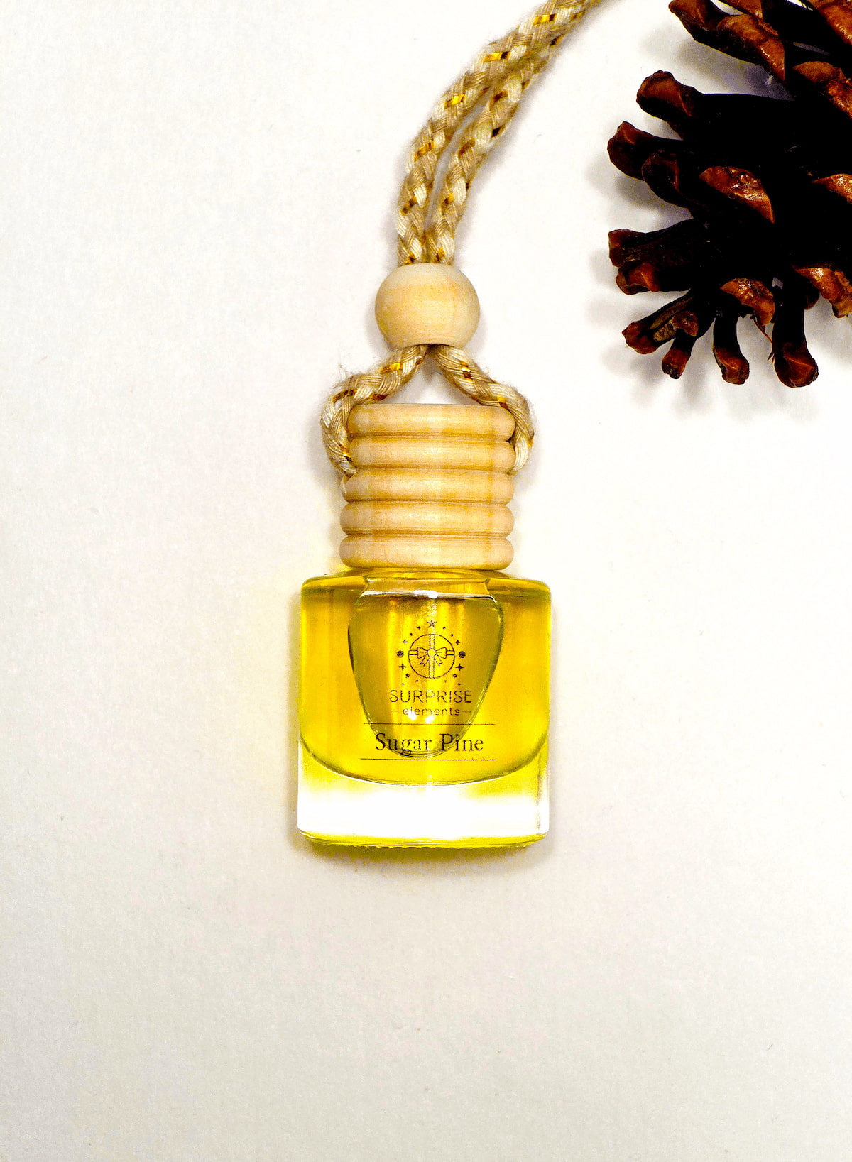 Small yellow bottle with wooden cap on a white background